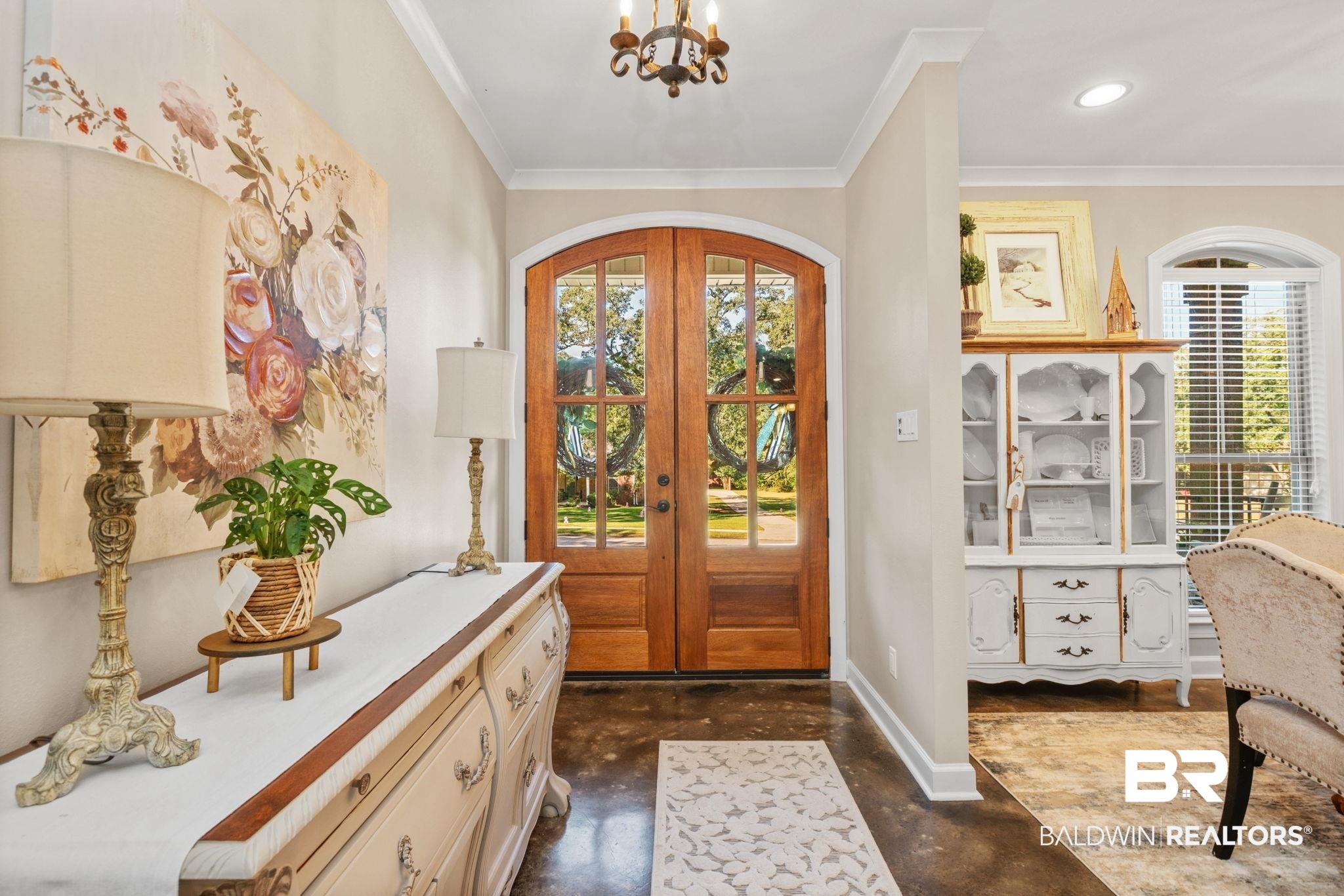 4331 Hamilton Oaks Lane Mobile, AL 36695 - Photo 3 of 38 Foyer featuring finished concrete floors, french doors, ornamental molding, a chandelier, and baseboards