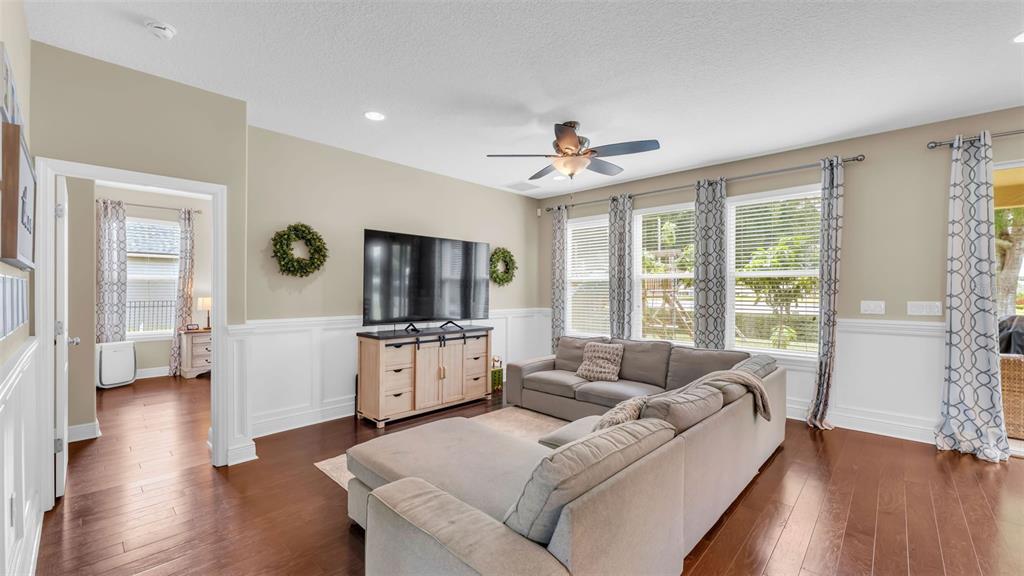 132 Magneta Loop Auburndale, FL 33823 - Photo 20 of 56 a living room with furniture and a flat screen tv