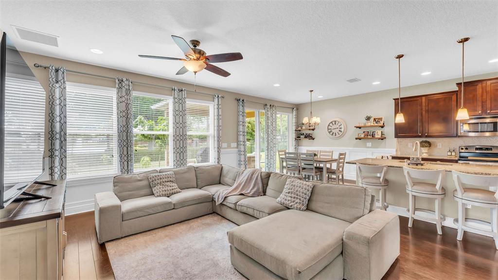 132 Magneta Loop Auburndale, FL 33823 - Photo 21 of 56 a living room with furniture kitchen area and a large window