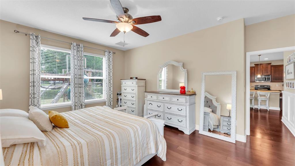 132 Magneta Loop Auburndale, FL 33823 - Photo 24 of 56 a bedroom with a bed and a large window