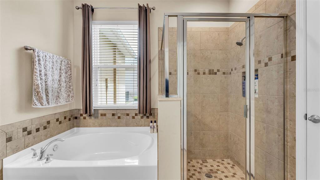 132 Magneta Loop Auburndale, FL 33823 - Photo 27 of 56 a white bath tub with a shower