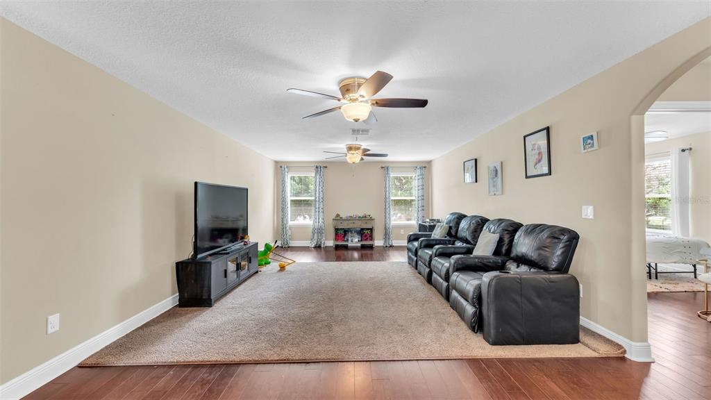 132 Magneta Loop Auburndale, FL 33823 - Photo 28 of 56 a living room with furniture and a flat screen tv
