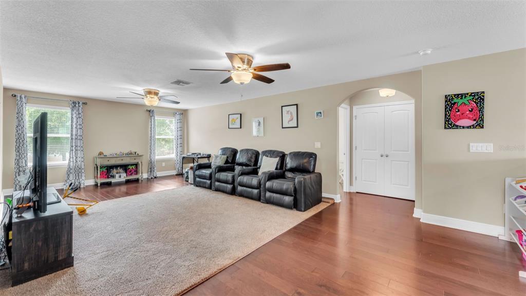 132 Magneta Loop Auburndale, FL 33823 - Photo 29 of 56 a living room with furniture and wooden floor