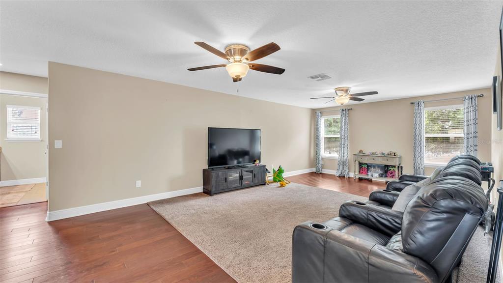 132 Magneta Loop Auburndale, FL 33823 - Photo 32 of 56 a living room with furniture and a flat screen tv