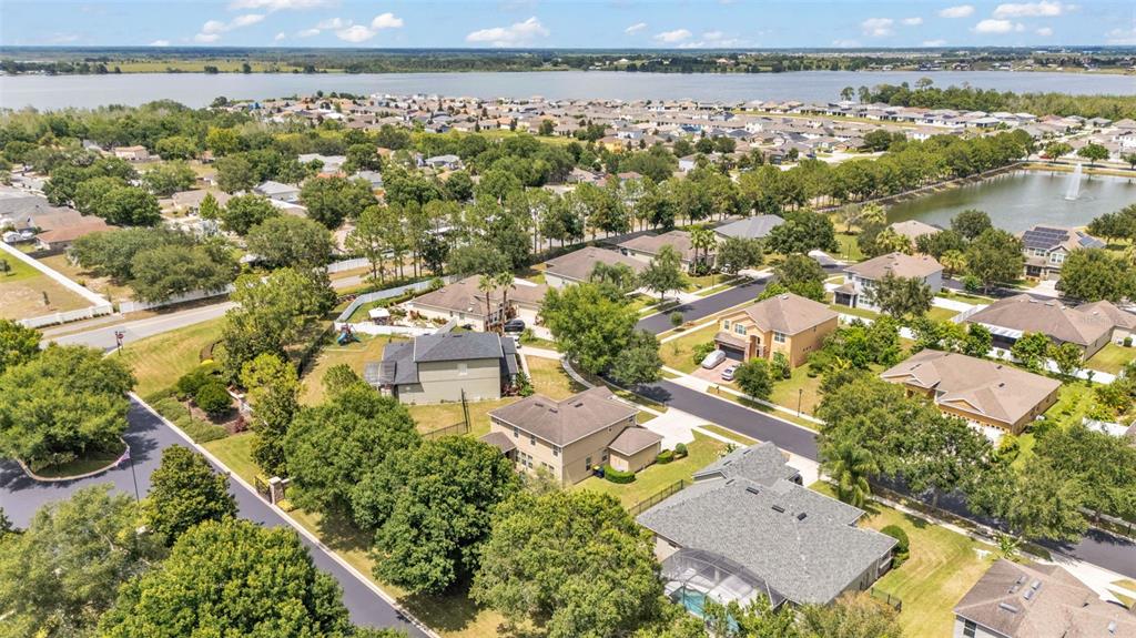 132 Magneta Loop Auburndale, FL 33823 - Photo 47 of 56 an aerial view of a residential houses with outdoor space and trees
