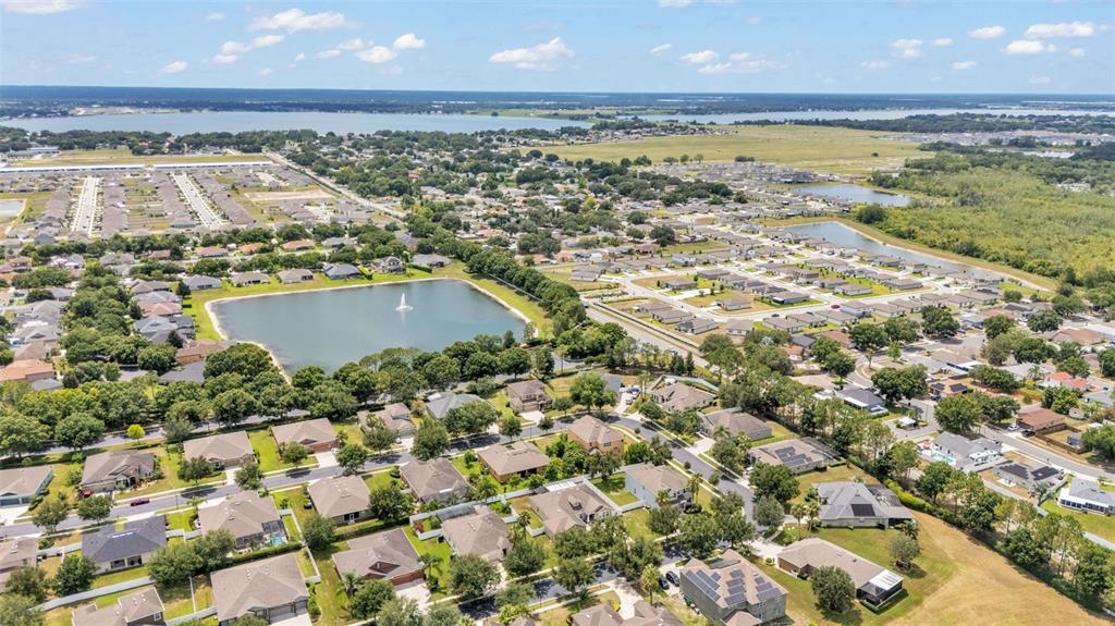132 Magneta Loop Auburndale, FL 33823 - Photo 49 of 56 an aerial view of residential houses with outdoor space