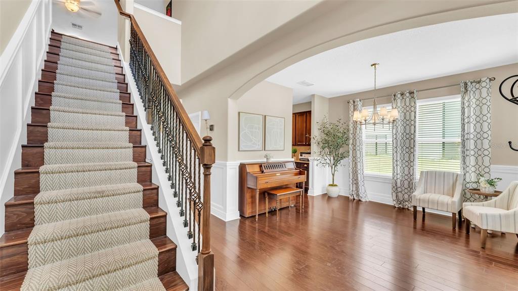 132 Magneta Loop Auburndale, FL 33823 - Photo 5 of 56 a view of entryway and dining room and wooden floor