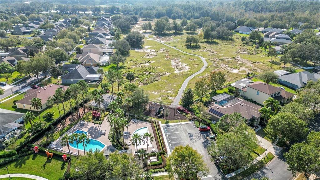 132 Magneta Loop Auburndale, FL 33823 - Photo 53 of 56 an aerial view of residential houses with outdoor space and trees