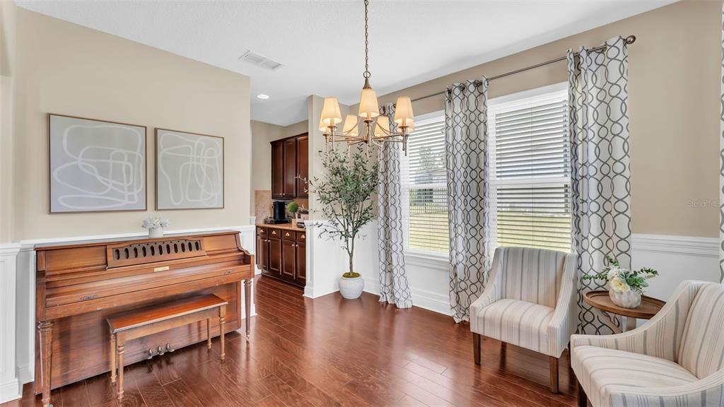132 Magneta Loop Auburndale, FL 33823 - Photo 8 of 56 a living room with furniture and a wooden floor