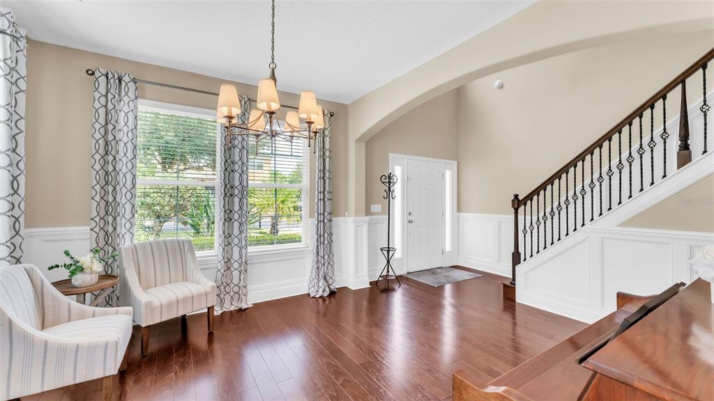 132 Magneta Loop Auburndale, FL 33823 - Photo 9 of 56 a view of an entryway with wooden floor and door