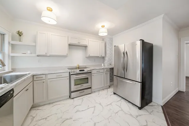 a view of entryway with wooden floor and stairs
