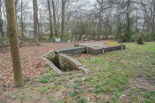 a view of swimming pool with a yard