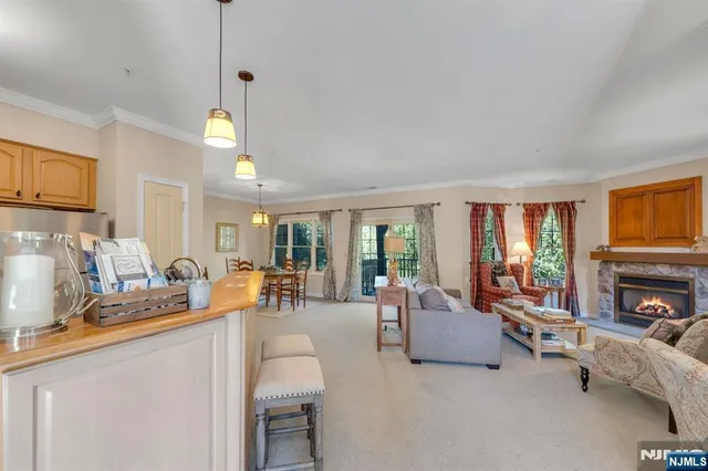 a living room with fireplace furniture and a flat screen tv