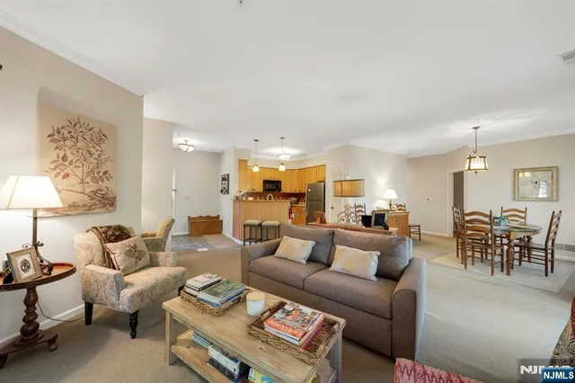 a living room with furniture and a table