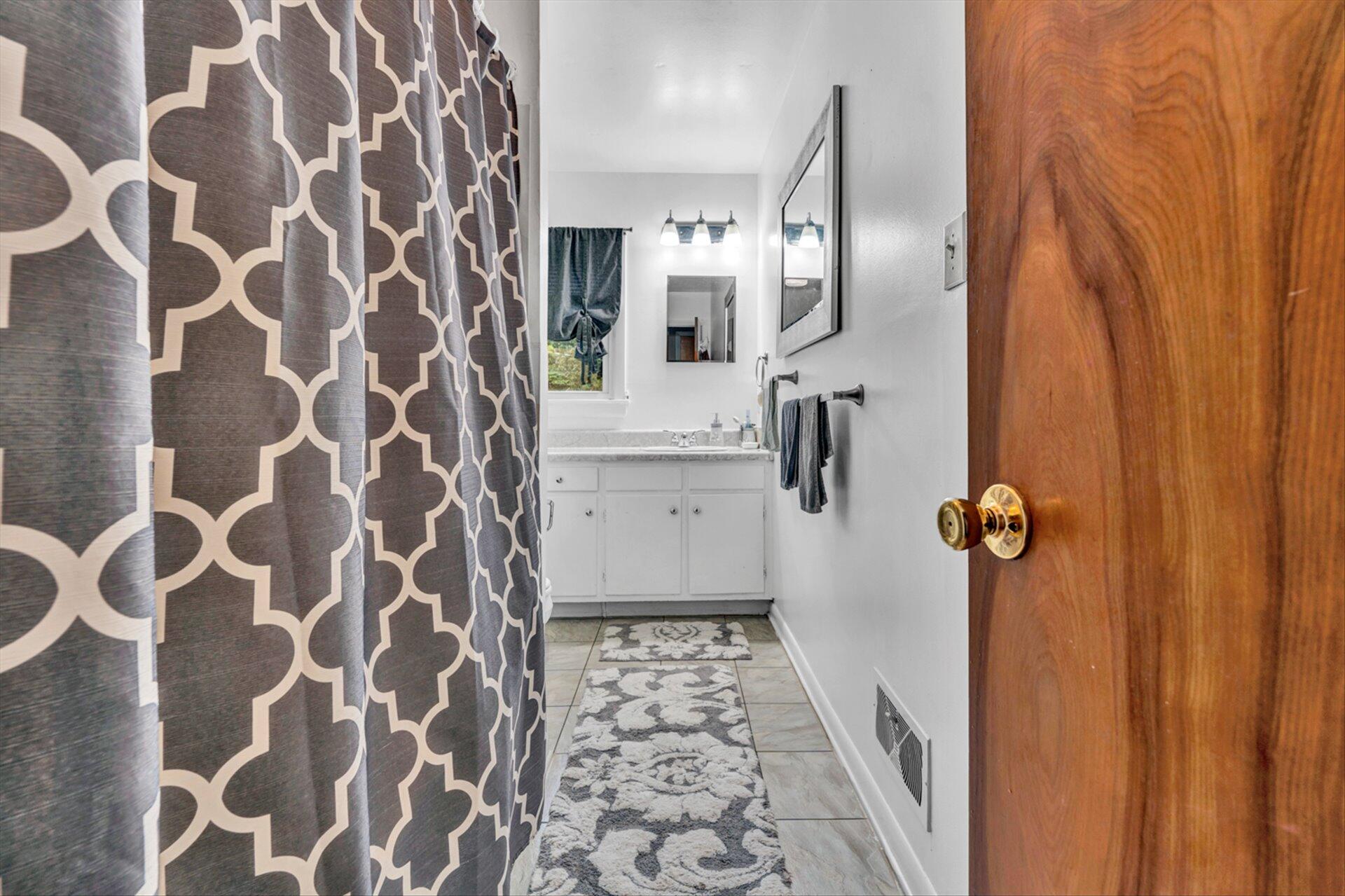3131 Galloway Drive Roanoke, VA 24018 - Photo 12 of 37 a bathroom with a sink and mirror
