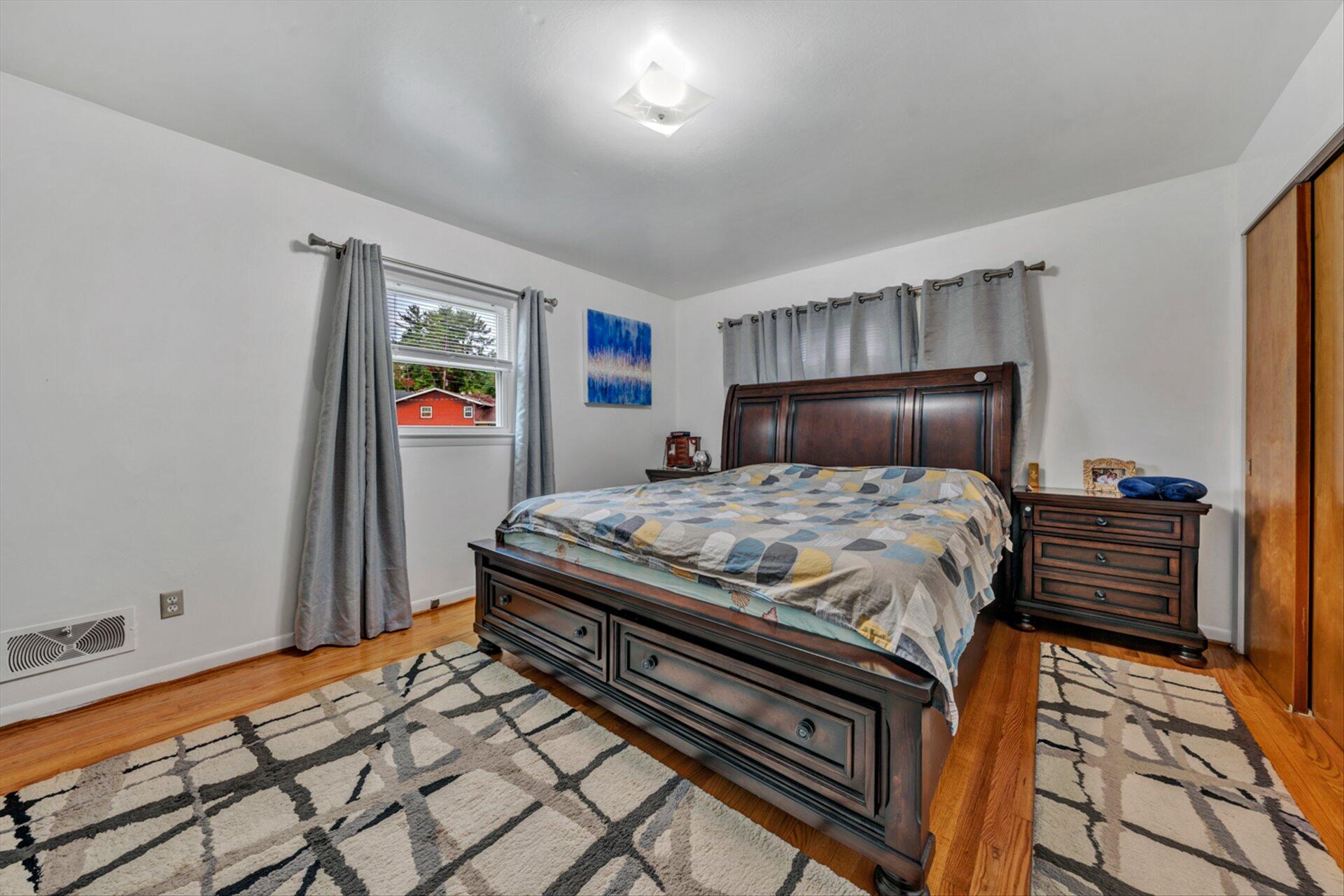 3131 Galloway Drive Roanoke, VA 24018 - Photo 14 of 37 a bedroom with a bed and wooden floor
