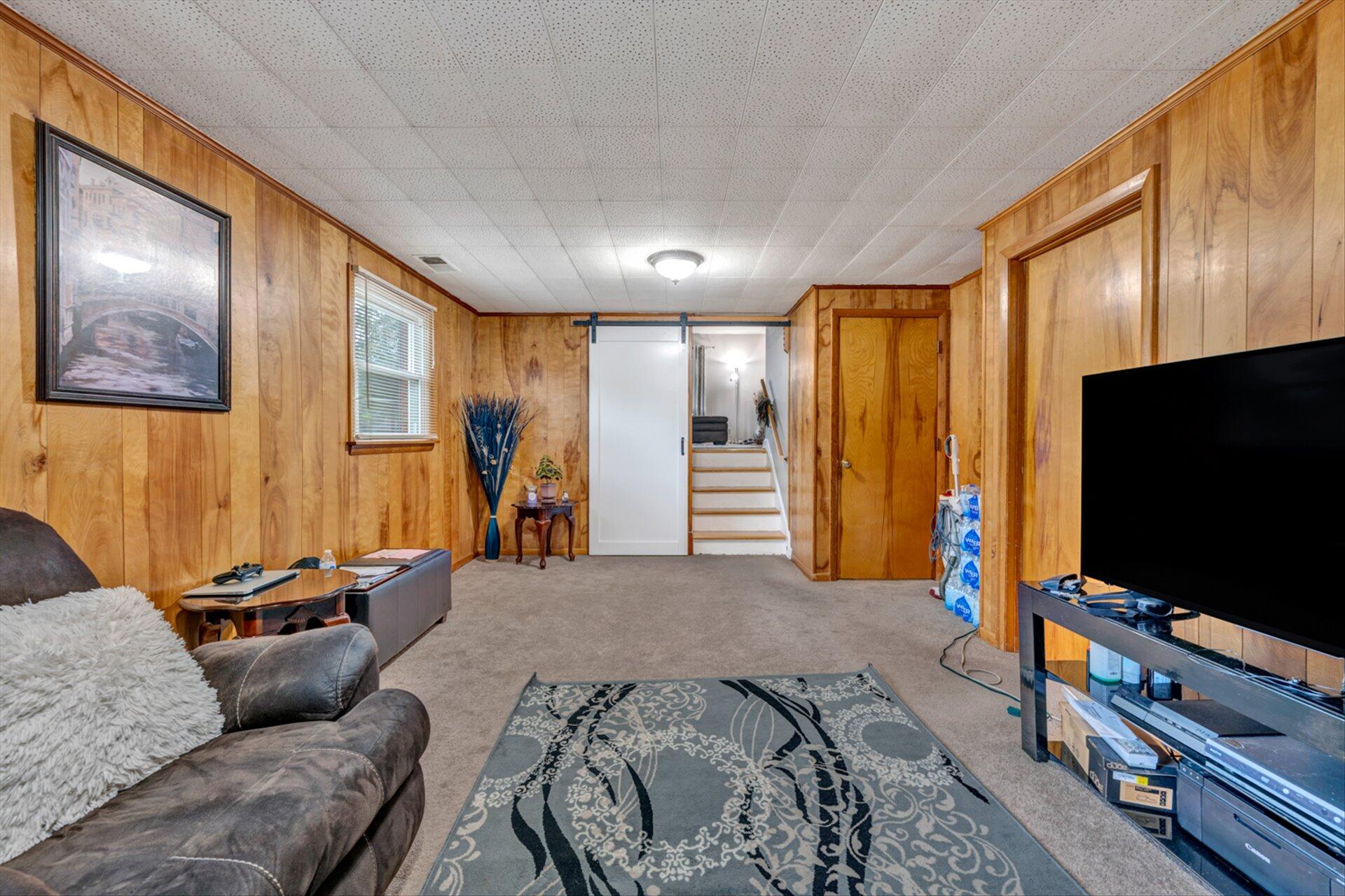 3131 Galloway Drive Roanoke, VA 24018 - Photo 17 of 37 a bedroom with furniture and a flat screen tv
