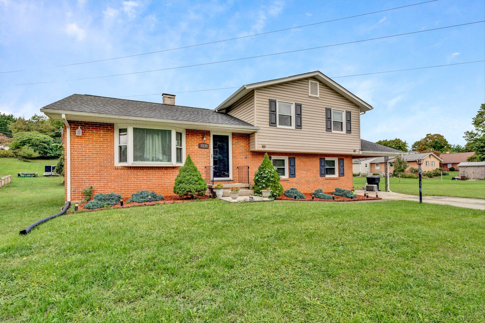 3131 Galloway Drive Roanoke, VA 24018 - Photo 2 of 37 a view of a house with a yard