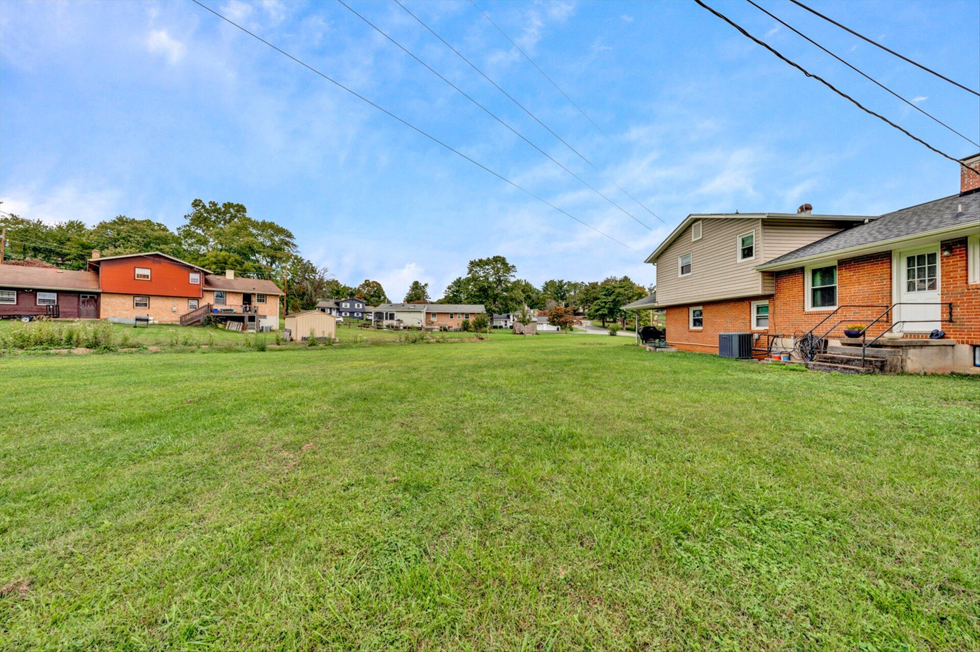 3131 Galloway Drive Roanoke, VA 24018 - Photo 32 of 37 a front view of house with yard and trees in the background