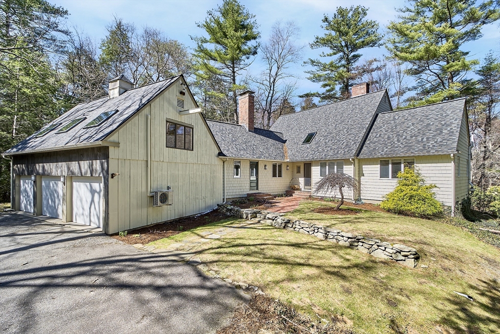 75 Westcott Road Harvard, MA 01451 - Photo 1 of 32 a view of a house with a yard and sitting area