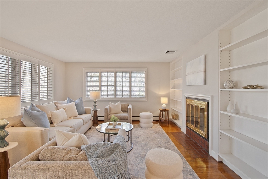 75 Westcott Road Harvard, MA 01451 - Photo 11 of 32 a living room with furniture and a fireplace