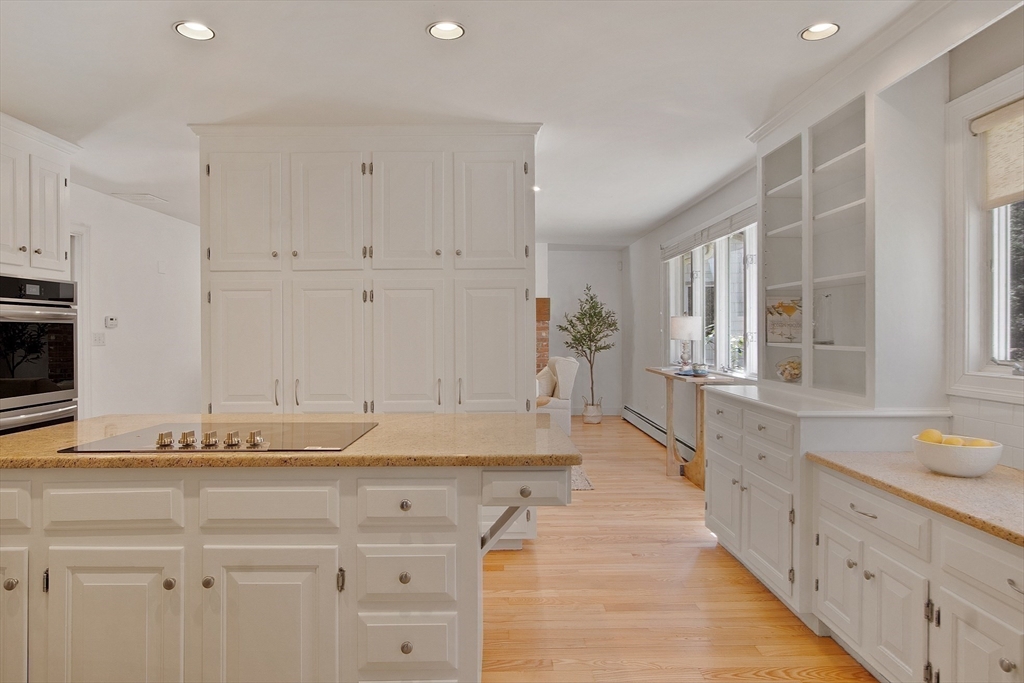 75 Westcott Road Harvard, MA 01451 - Photo 16 of 32 a large white kitchen with granite countertop a sink and white cabinets