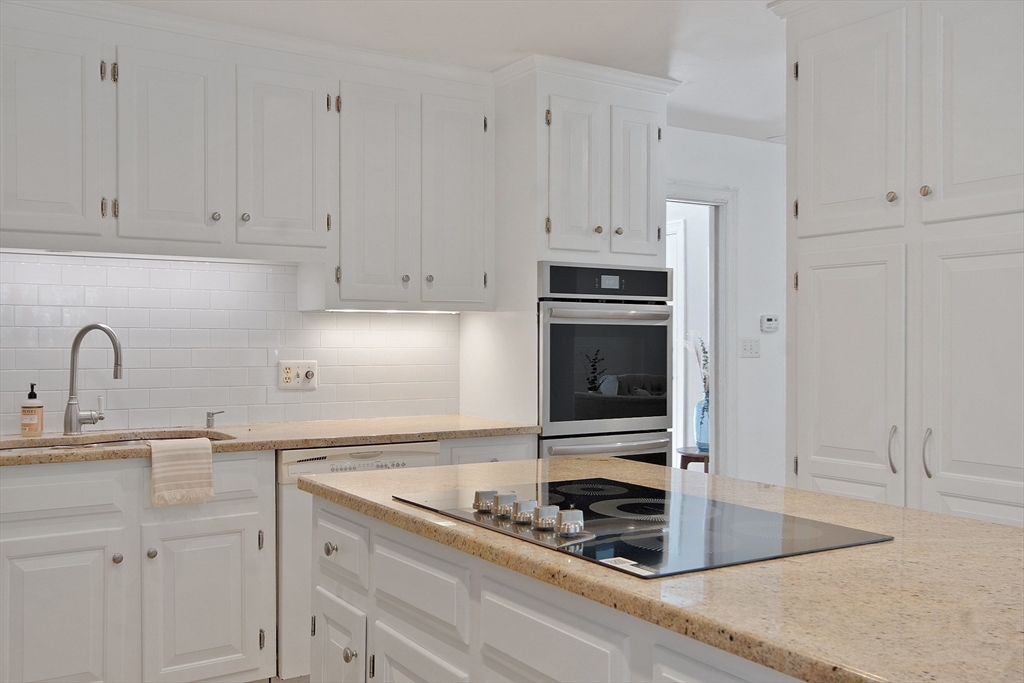 75 Westcott Road Harvard, MA 01451 - Photo 20 of 32 a kitchen with white cabinets and appliances