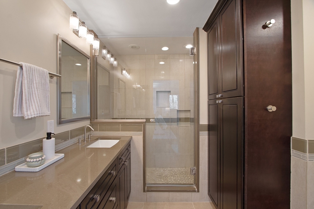 75 Westcott Road Harvard, MA 01451 - Photo 10 of 32 a bathroom with a granite countertop sink a shower and a mirror