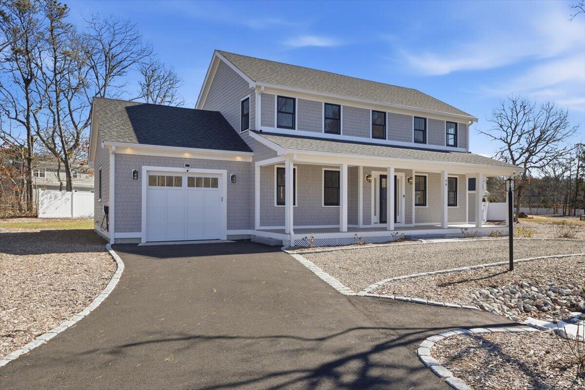 58 Old Chatham Road Brewster, MA 02631 - Photo 40 of 43 a front view of a house with a yard