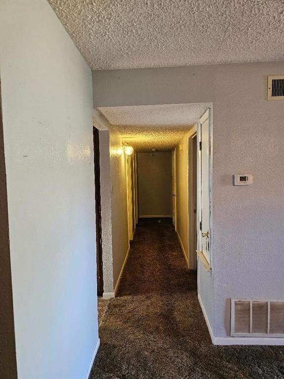 538 Massey Street Athens, TX 75751 - Photo 29 of 32 a view of a hallway with wooden floor and a couch