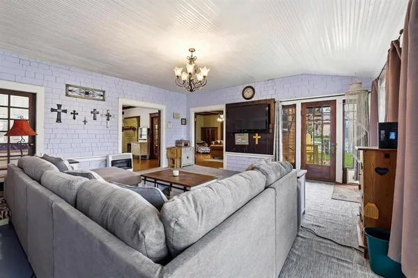 a living room with furniture fireplace and flat screen tv