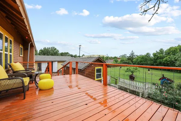 a view of a balcony with chairs