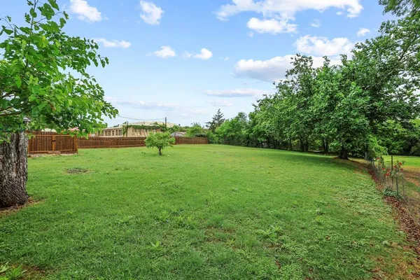a view of outdoor space with deck and yard