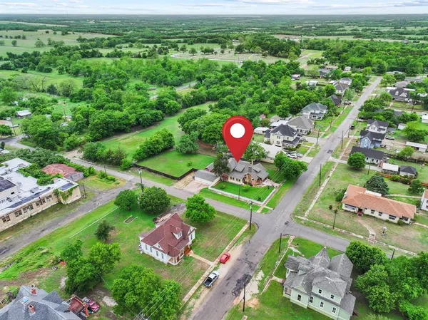 an aerial view of a house with a garden