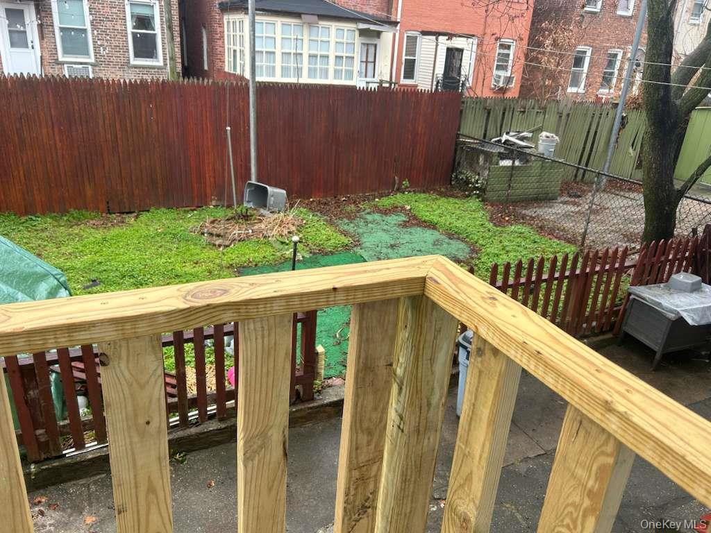 88-23 85th Street, Unit 1L Queens, NY 11421 - Photo 15 of 17 a view of a house with backyard and sitting area