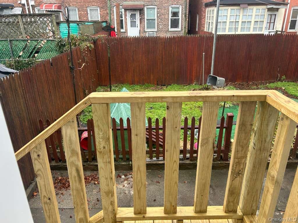 88-23 85th Street, Unit 1L Queens, NY 11421 - Photo 16 of 17 a view of a house with street