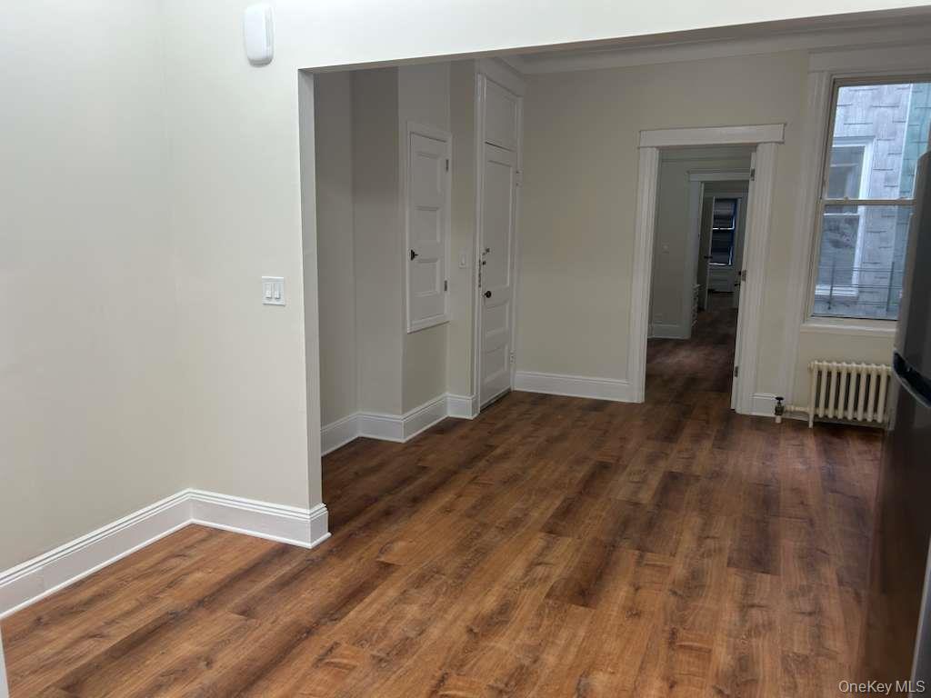 88-23 85th Street, Unit 1L Queens, NY 11421 - Photo 2 of 17 wooden floor in an empty room
