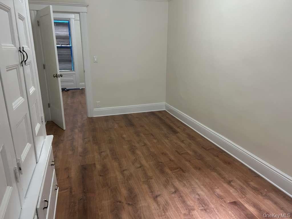 88-23 85th Street, Unit 1L Queens, NY 11421 - Photo 8 of 17 a view of wooden floor in an empty room