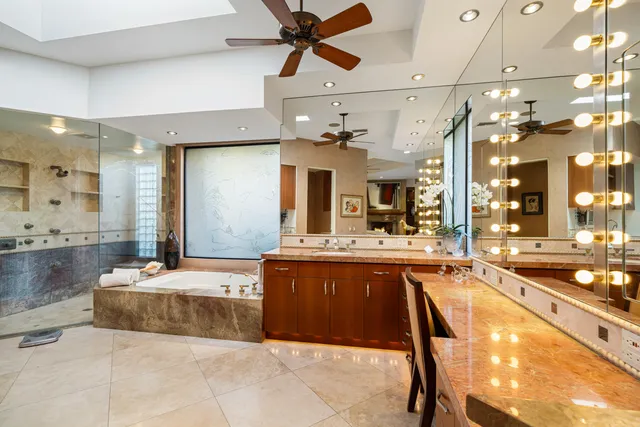 a large kitchen with a table and chairs