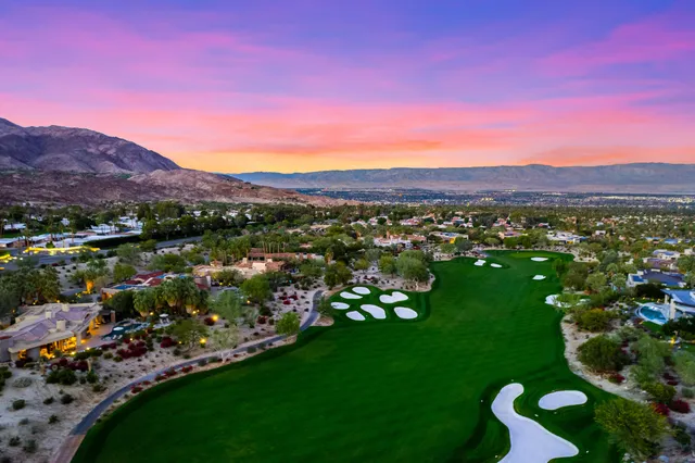 a view of a city with mountains in the background