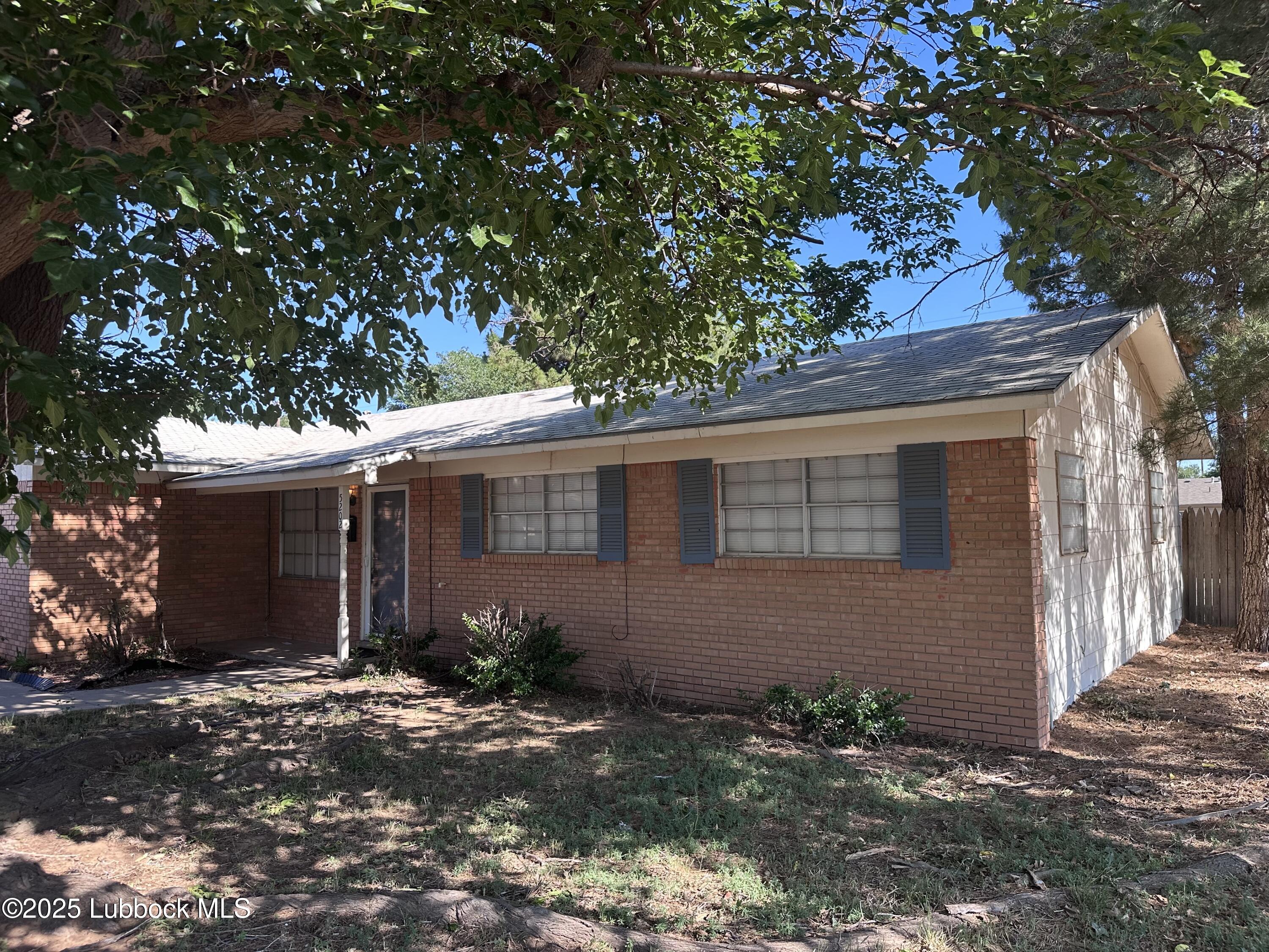 5202 41st Street Lubbock, TX 79414 - Photo 2 of 18 a view of a house with a yard