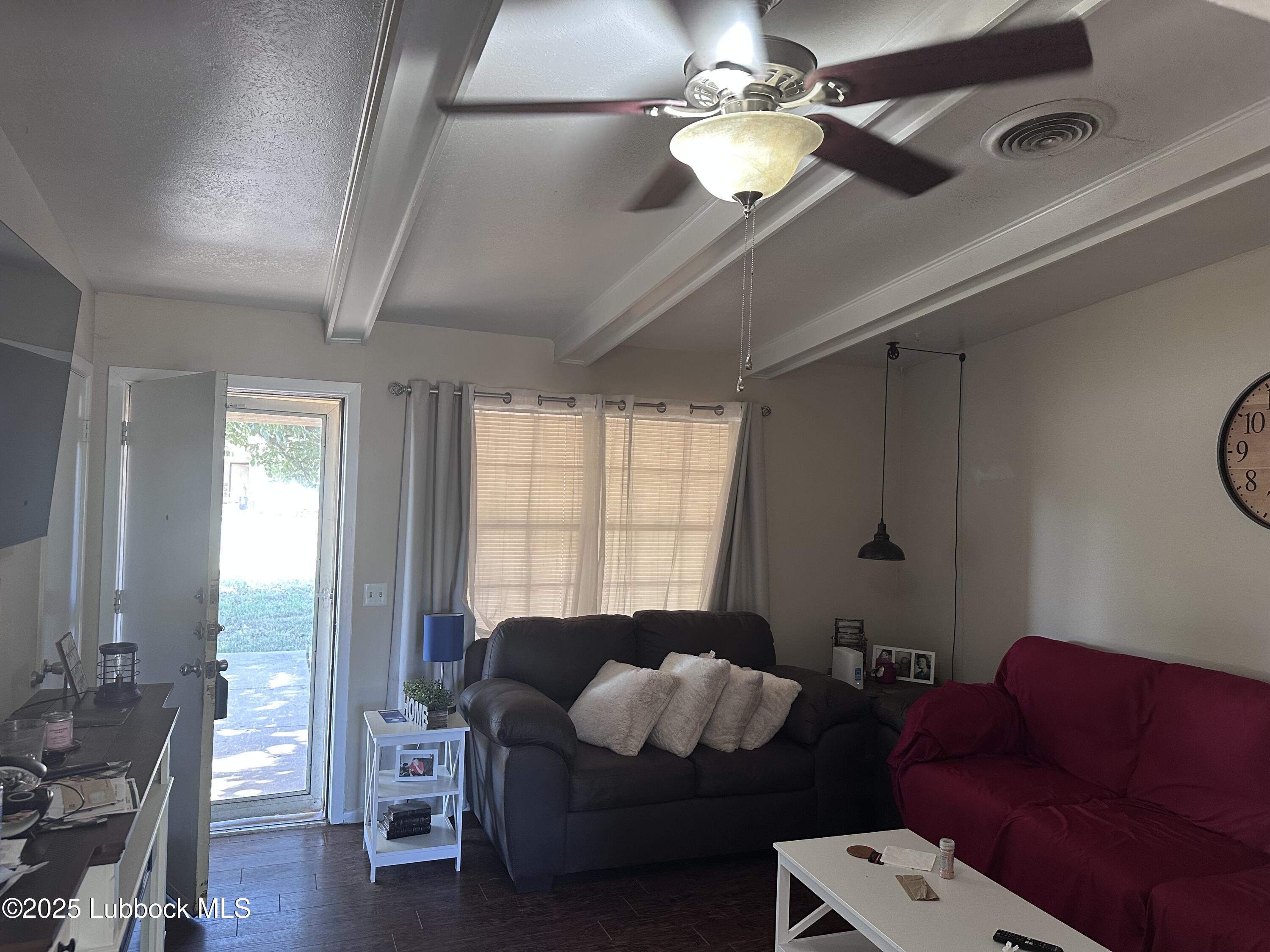 5202 41st Street Lubbock, TX 79414 - Photo 4 of 18 a living room with furniture and wooden floor