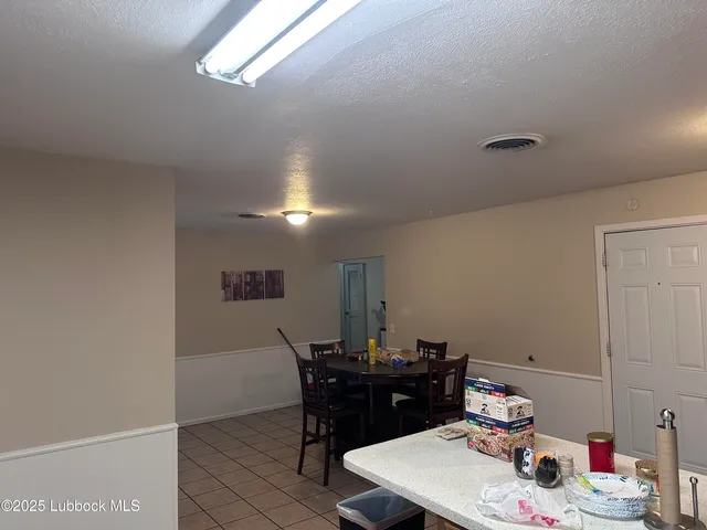 a view of a workspace with furniture