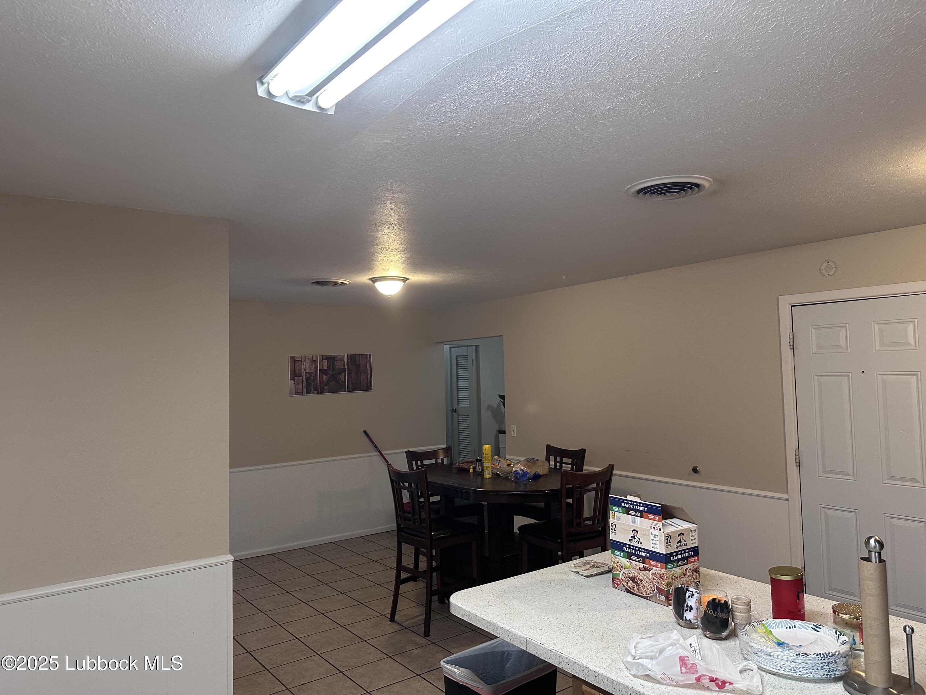 5202 41st Street Lubbock, TX 79414 - Photo 8 of 18 a view of a workspace with furniture