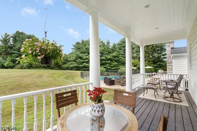 a view of a patio with couches plants dining table and chairs