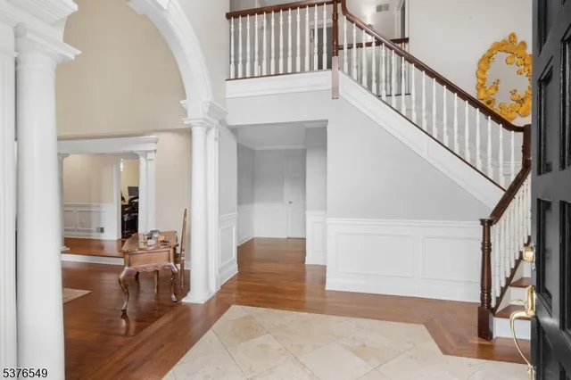 a view of staircase with white walls and railing