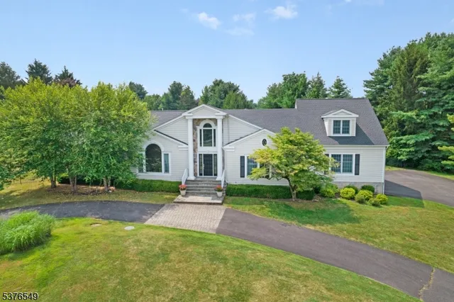 a aerial view of a house next to a yard
