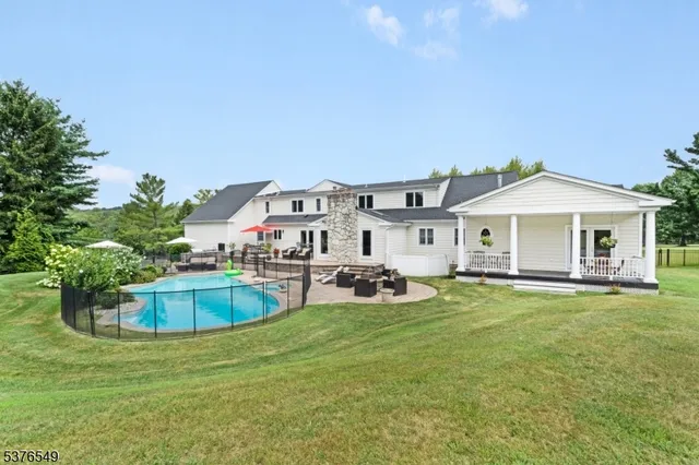 a front view of house with yard and outdoor seating