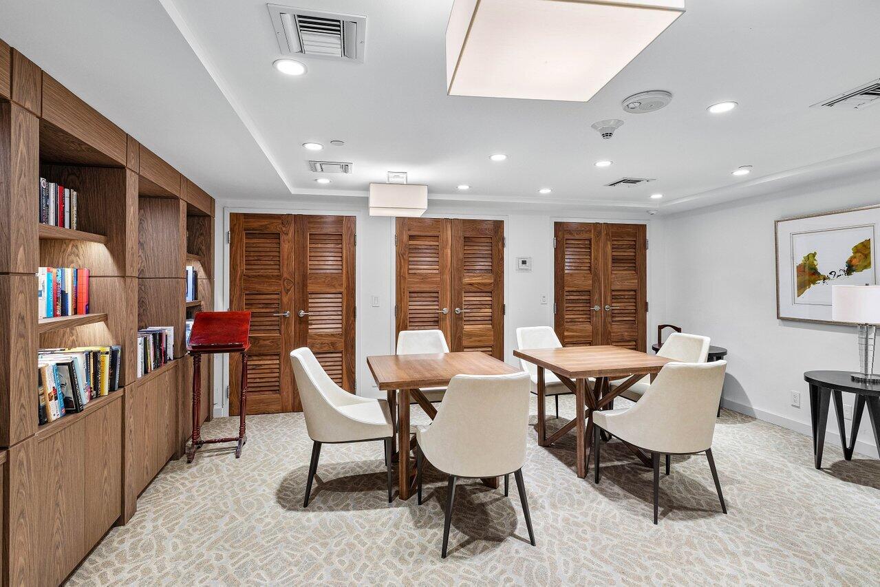 1500 South Ocean Boulevard, Unit 804 Boca Raton, FL 33432 - Photo 36 of 45 a dining room with furniture and a floor to ceiling window