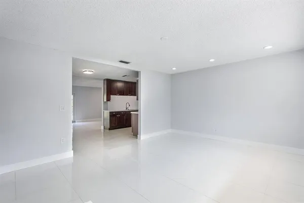 a view of a kitchen with a sink and a stove